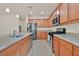 Kitchen featuring granite countertops, stainless steel appliances, and wood floors at 8919 Don Valley Ave, Las Vegas, NV 89148