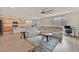 Open living room and kitchen area featuring wood floors and stainless steel appliances at 8919 Don Valley Ave, Las Vegas, NV 89148