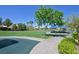 Community park featuring green space, mature trees, walking path, picnic shelter with tables and neighborhood views at 8919 Don Valley Ave, Las Vegas, NV 89148