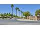 Well maintained community entrance with lush trees and desert landscaping at 8919 Don Valley Ave, Las Vegas, NV 89148