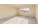 Sunlit bedroom with soft carpeting, providing a cozy and adaptable environment at 9737 Toad Hollow St, Las Vegas, NV 89141