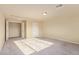 Spacious bedroom with plush carpeting, offering a comfortable and versatile living space at 9737 Toad Hollow St, Las Vegas, NV 89141