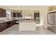 Stylish kitchen featuring granite countertops, stainless steel appliances, and pendant lighting at 9737 Toad Hollow St, Las Vegas, NV 89141