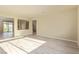 Bright living room showing the staircase and access to an outdoor patio at 9737 Toad Hollow St, Las Vegas, NV 89141