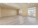 Spacious living room with large windows and a sliding door, offering plenty of natural light at 9737 Toad Hollow St, Las Vegas, NV 89141