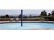 Leisurely pool area with water feature and mountain views beyond at 9904 Arbuckle Dr, Las Vegas, NV 89134
