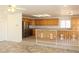 Spacious kitchen with stainless steel appliances, wood cabinets, and tile floors at 9904 Arbuckle Dr, Las Vegas, NV 89134