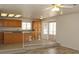 Kitchen and breakfast nook with tile floors and a view of the kitchen with wood cabinets at 9904 Arbuckle Dr, Las Vegas, NV 89134