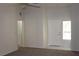Light and airy living room featuring neutral walls, tile entrance, and a front door at 9904 Arbuckle Dr, Las Vegas, NV 89134