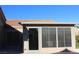 Covered patio with screens and access to the backyard provides an ideal space for relaxation and entertainment at 9904 Arbuckle Dr, Las Vegas, NV 89134