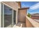 Relaxing balcony with concrete flooring and stucco walls, perfect for enjoying outdoor living at 10509 Hartford Hills Ave, Las Vegas, NV 89166