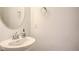 This bathroom features a sink, mirror, decorative liquid soap dispenser, and textured walls at 10509 Hartford Hills Ave, Las Vegas, NV 89166