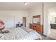 Bright bedroom offering neutral walls, a large bed, and walk-in closet access, for optimal storage and comfort at 10509 Hartford Hills Ave, Las Vegas, NV 89166