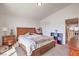 Comfortable bedroom featuring a large bed, coordinating furniture, and ample natural light, creating a relaxing retreat at 10509 Hartford Hills Ave, Las Vegas, NV 89166