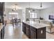 Open floor plan features a kitchen with granite countertops that flows into the living space at 10509 Hartford Hills Ave, Las Vegas, NV 89166