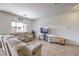 Comfortable living room with a large window and tile flooring at 10509 Hartford Hills Ave, Las Vegas, NV 89166