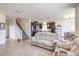 Spacious living area with tile flooring and stairs leading to the second floor at 10509 Hartford Hills Ave, Las Vegas, NV 89166
