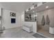 Modern bathroom with tile floors, a glass-enclosed shower, and a white bench for a spa-like experience at 10729 Marathon Bell Ln, Las Vegas, NV 89129