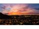 Vibrant city skyline at dusk with fiery skies and illuminated buildings at 10729 Marathon Bell Ln, Las Vegas, NV 89129