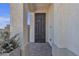 Modern front door showcasing contemporary design and textured exterior walls for a welcoming entrance at 10729 Marathon Bell Ln, Las Vegas, NV 89129