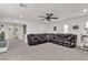 Entertainment room with plush seating, a ceiling fan, and backyard view at 10729 Marathon Bell Ln, Las Vegas, NV 89129