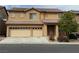 Charming two-story home featuring a three-car garage and well-maintained landscaping at 108 Spur Ranch Ave, North Las Vegas, NV 89032