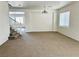 Spacious living area with stairway, neutral walls, carpet, and ample natural light at 108 Spur Ranch Ave, North Las Vegas, NV 89032