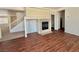Cozy living area featuring a fireplace, wood flooring, and an open layout at 108 Spur Ranch Ave, North Las Vegas, NV 89032