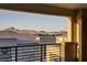 Inviting balcony view features rooftops in a modern neighborhood and mountains in the distance at 1103 Tektite Ave, Henderson, NV 89011