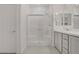 Bathroom with a glass enclosed shower and double vanity sinks at 1103 Tektite Ave, Henderson, NV 89011