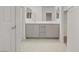 Bright bathroom with double vanity, walk-in closet, and tiled flooring at 1103 Tektite Ave, Henderson, NV 89011