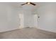 An open concept bedroom showcasing neutral carpeting and access to closet and bathroom at 1103 Tektite Ave, Henderson, NV 89011