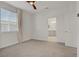 Bright bedroom featuring neutral carpeting, white walls, and a ceiling fan at 1103 Tektite Ave, Henderson, NV 89011