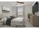 Cozy bedroom features a comfortable bed, stylish decor, soft lighting, and a large window for natural light at 1103 Tektite Ave, Henderson, NV 89011