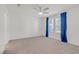 Bright bedroom with large windows and contemporary blue curtains at 1103 Tektite Ave, Henderson, NV 89011