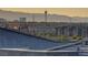 Scenic city view features the Las Vegas skyline and mountains in the background, atop a gray tiled roof at 1103 Tektite Ave, Henderson, NV 89011