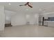 Open-concept living area with tile flooring, stairs, and modern kitchen at 1103 Tektite Ave, Henderson, NV 89011