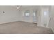 Upstairs living room with plush carpeting, outside access, lots of natural light, and stairway access at 1103 Tektite Ave, Henderson, NV 89011