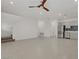 Open-concept living area with tile flooring, stairs, and modern kitchen at 1103 Tektite Ave, Henderson, NV 89011