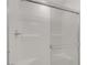 Modern shower featuring a glass door and white tiled walls at 1103 Tektite Ave, Henderson, NV 89011