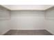Walk-in closet with carpeted flooring and wooden shelving at 1103 Tektite Ave, Henderson, NV 89011