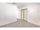 Spacious bedroom features neutral walls, carpet, closet with sliding doors and an ensuite bathroom at 133 Park Ridge Ln, Henderson, NV 89002
