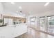 Bright kitchen with light wood cabinets, white appliances, breakfast bar and tile floors at 133 Park Ridge Ln, Henderson, NV 89002