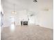 Bright and airy living room with a fireplace, neutral tile flooring, and ample space at 133 Park Ridge Ln, Henderson, NV 89002