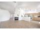 Bright open living room featuring tile floors, a fireplace, and bar seating to the kitchen at 133 Park Ridge Ln, Henderson, NV 89002