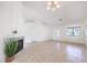 Open-concept living area with tile flooring, fireplace and multiple windows providing ample sunlight at 133 Park Ridge Ln, Henderson, NV 89002