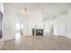 Inviting living room showcasing a cozy fireplace, neutral tile flooring, and an open layout at 133 Park Ridge Ln, Henderson, NV 89002