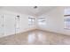 Spacious room with tile flooring and three windows, providing natural light at 133 Park Ridge Ln, Henderson, NV 89002