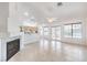 Spacious living room with tile flooring, fireplace, bar seating to the kitchen, and abundant natural light at 133 Park Ridge Ln, Henderson, NV 89002