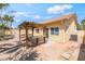 Backyard featuring an inviting pergola, ideal for outdoor dining and relaxation at 1363 Yeager Ave, Las Vegas, NV 89123